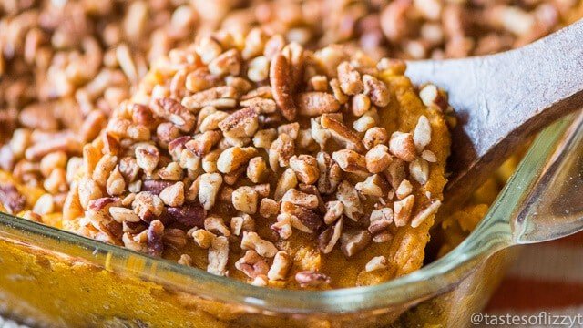 Whole30 sweet potato casserole topped with chopped pecans