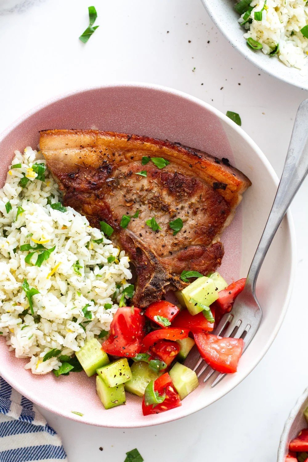 Pork chops served with Greek lemon rice