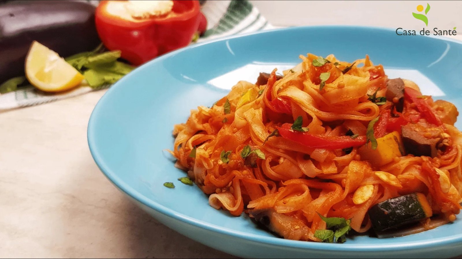 Vegetable pasta stir fry with peppers, zucchini, and eggplant